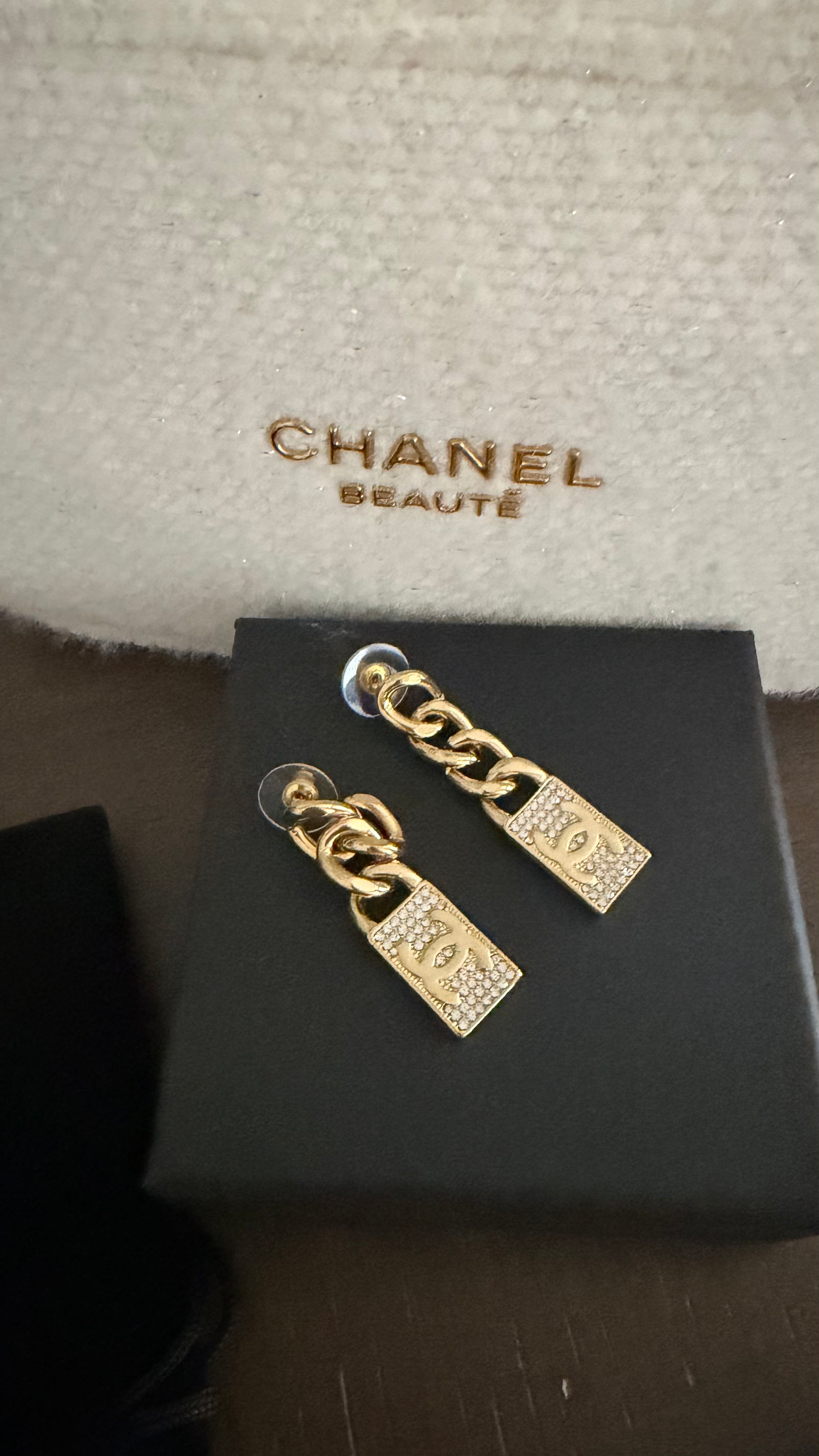 CC gold earrings with diamonds